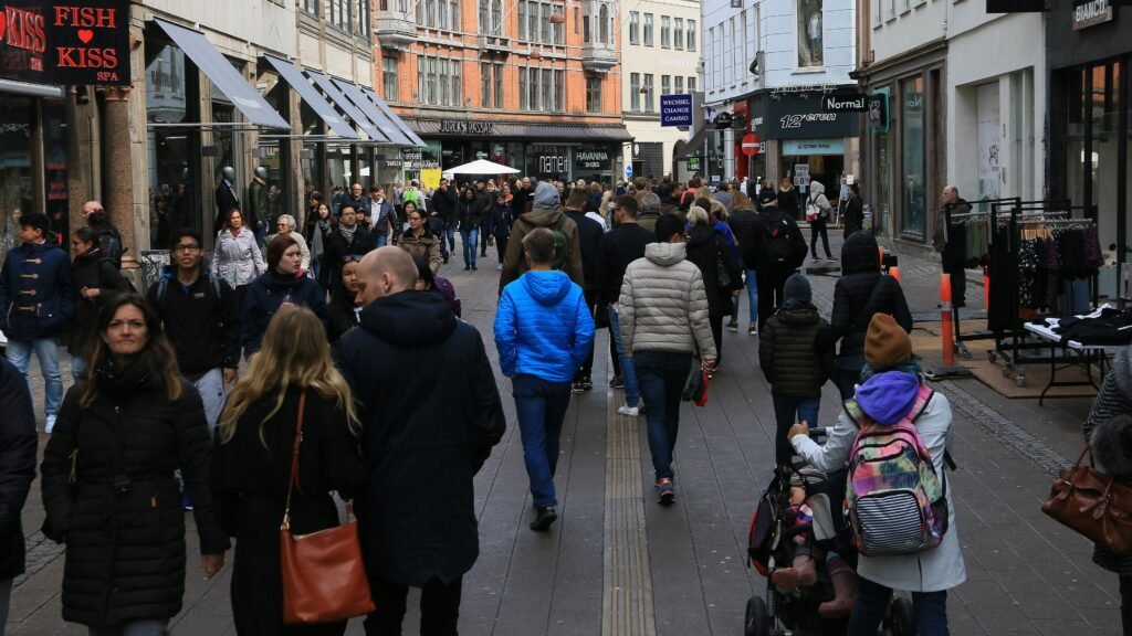 Crowds walking along a pedestrian street in central Copenhagen