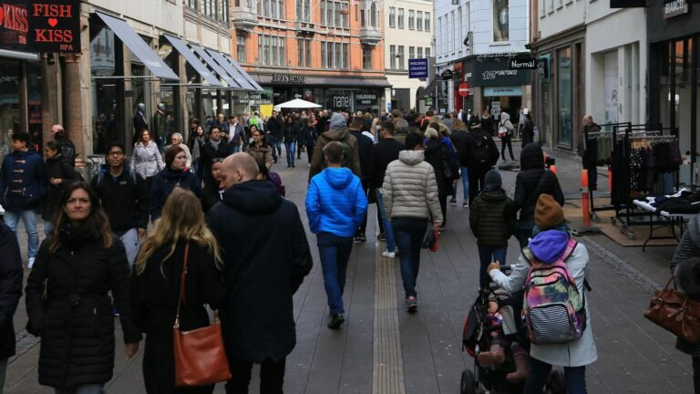 Crowds walking along a pedestrian street in central Copenhagen